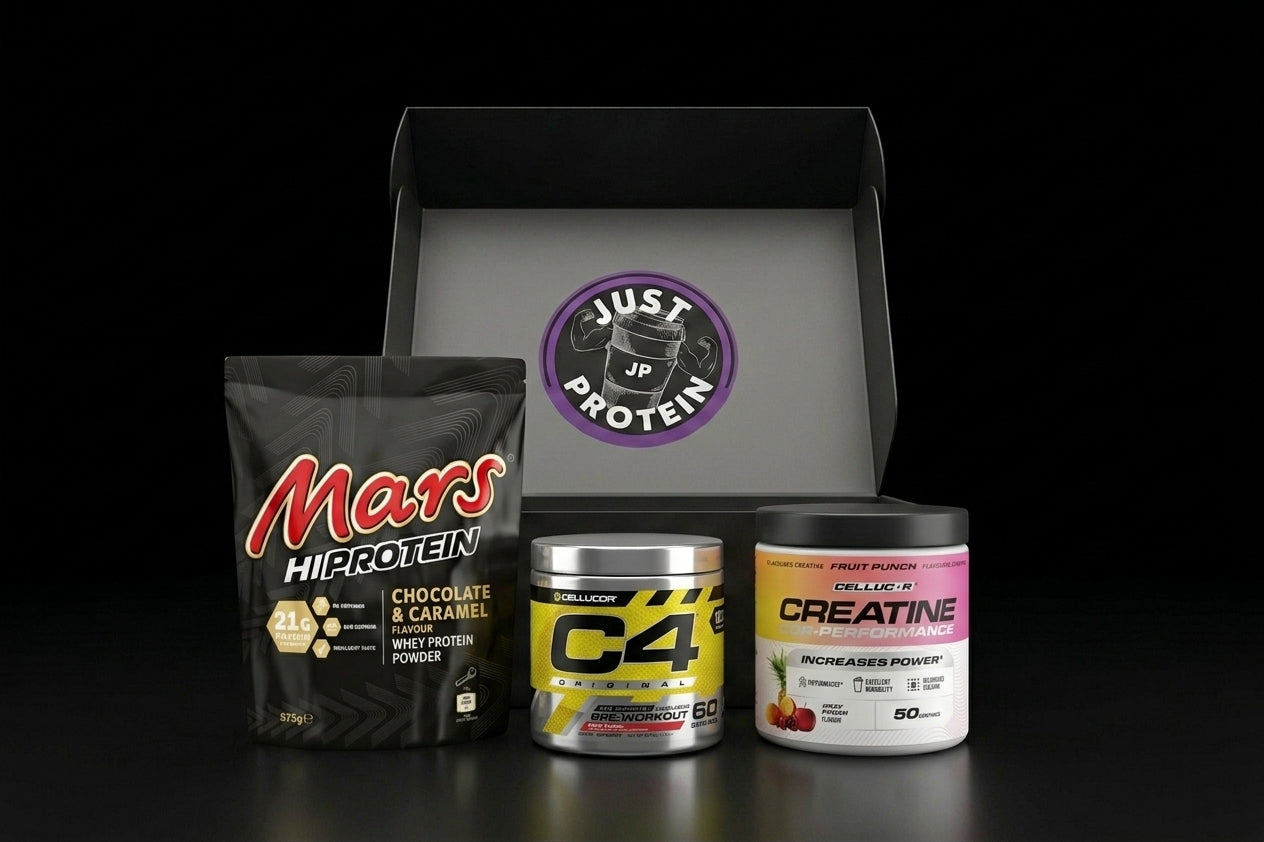 A curated supplement bundle featuring a black bag of Mars Hiprotein, a silver canister of C4 Protein, and a white tub of Creatine by Pulse Nutrition, arranged in front of an open black gift box with a purple 'Just Up Protein' logo on a black background.