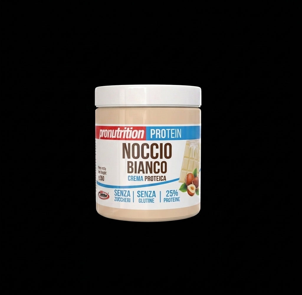 A jar of Pronutrition Noccio Bianco protein powder on a solid black background. The container is beige with a white lid and features a label with red, blue, and brown text.